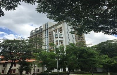 Chulalongkorn University Faculty of Science, a white high-rise seen through large trees